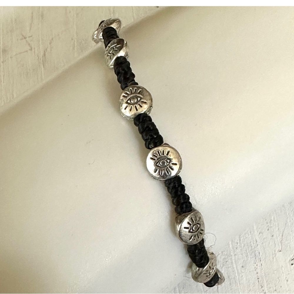 Black cord silver tone eye beaded bracelet